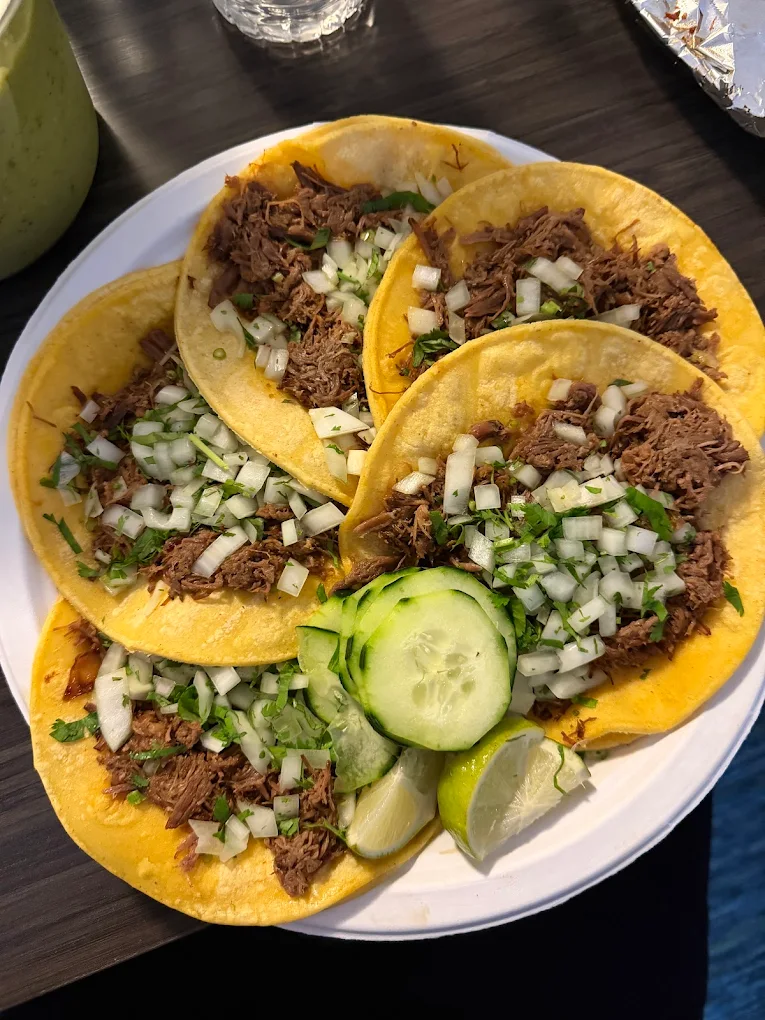 Tacos with onion, cilantro and cucumber